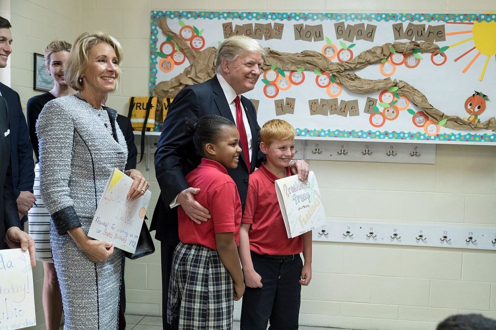 Betsy DeVos and Donald Trump with Students