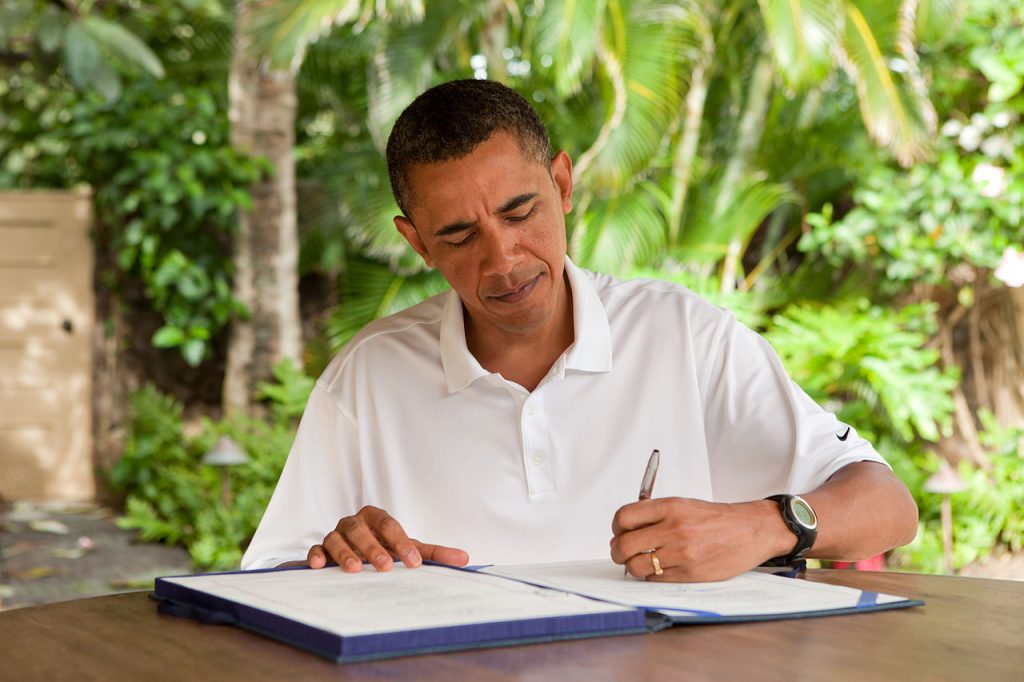 President Barack Obama signs H.R. 847, the "James Zadroga 9/11 Health and Compensation Act" in Kailua, Hawaii, January 2, 2011