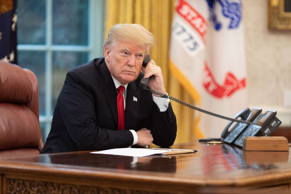 President Donald Trump Uses a Phone