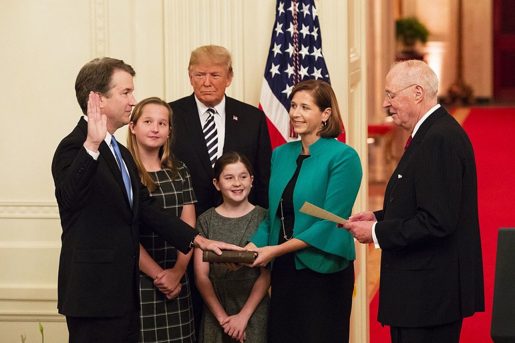 President Donald J. Trump looks on as Anthony M. Kennedy, retired Associate Justice of the Supreme Court of the United States, swears in Judge Brett M. Kavanaugh