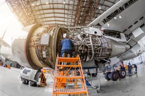 Aircraft Mechanic working on engine